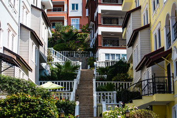A narrow street among the houses. Stairs leading to the top. Turkey