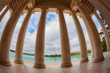 Fototapeta premium United States: Thomas Jefferson Memorial columns and interior over Washington monument column