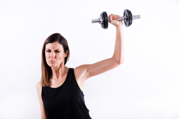 Fototapeta premium Young woman lifting weight