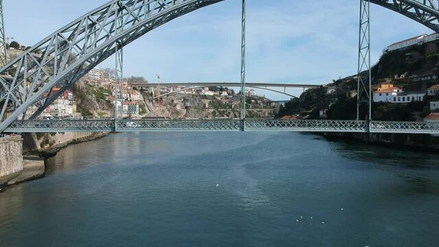 Zooming out of the old eiffel bridge over river