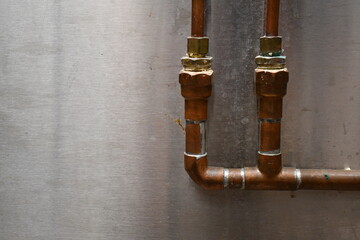Obraz na płótnie Canvas Copper pipes in an industrial kitchen.
