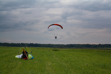paraglider flying in the sky or paramoto pilot  flying  in the sky