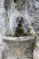 Fototapeta na wymiar Ancient fountain with lion