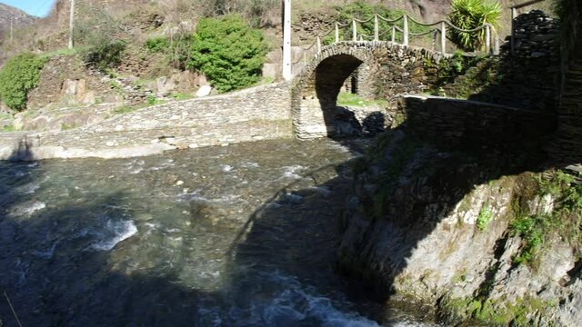 stone shale bridge from small village foz de &eacute;gua Piod&atilde;o Portugal slow motion 4k