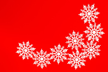 new year card, snowflakes on red background, view from above 