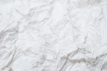 Crumpled white paper background.