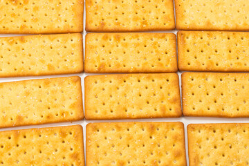 Cracker with salt isolated on white.