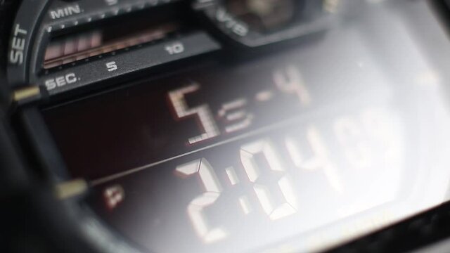 Macro close up of a tactical digital watch face functioning
