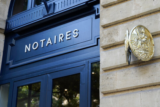 Notaire french notary blue entrance with text sign and logo on building office