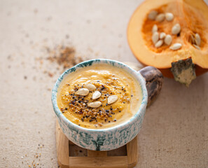 Delicious composition with pumpkin soup, top view.