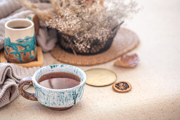 Cozy home still life with a Cup of tea on the table.