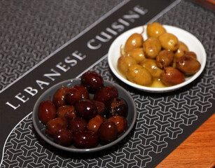 Bowls of green and black olives