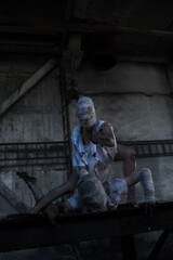 Dirty monsters boy and girl with bandaged faces