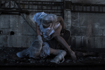 Dirty monsters boy and girl with bandaged faces