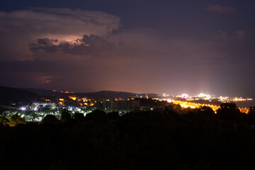 Lightning flashes in the night sky before the start of a thunderstorm, city, Turkey