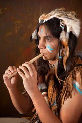 Indian playing the flute © Anneke