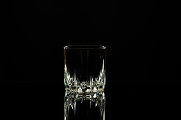Empty glass for whiskey, brandy or bubon, old fashion type, copy space, selective focus, there is a place for writing text