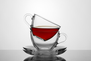 beautiful two cups with tea on a white background