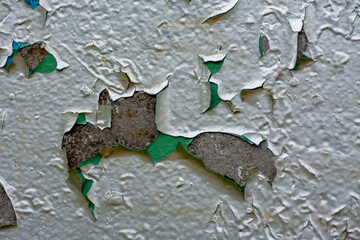 Wall with peeling oil paint.