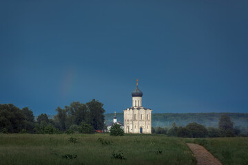 Fototapeta na wymiar Church of Intercession on the Nerlin the rainy spring evening. Russia