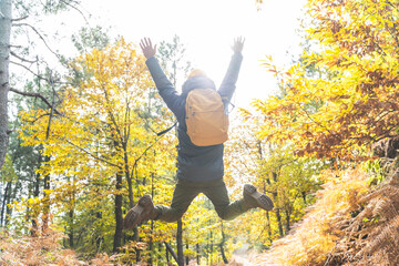 Young Man Jumping in the Forest in Autumn.