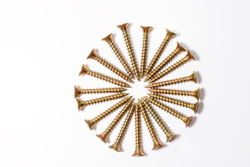 The gold screws are arranged in a circle on a white background. Yellow zinc head screws top view