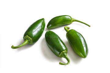 Green jalapeno peppers on a white background