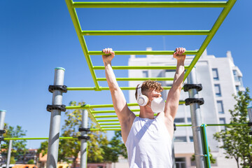 Young Man Training Outdoors Wearing Mask.