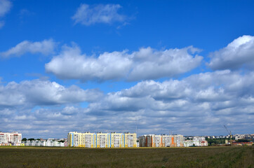 Fototapeta na wymiar Building a new city against a blue sky