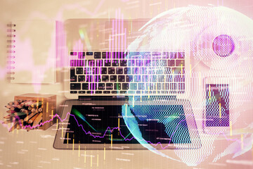 Stock market chart and top view computer on the table background. Multi exposure. Concept of financial analysis.