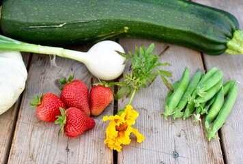 Freshly harvested organic home grown late summer vegetables ready for preparing and eating healthy homemade meals during early fall