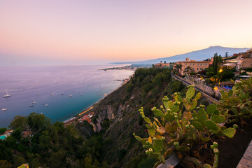 Romantic sunset At the main Belvedere of Taormina, Sicily, South of Italy.