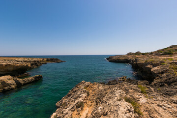 Clear Light blue sea at Siracuse coast in  a wild place called Pillirina, Sicily, South of Italy.