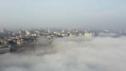 Aerial view of the city in the fog.