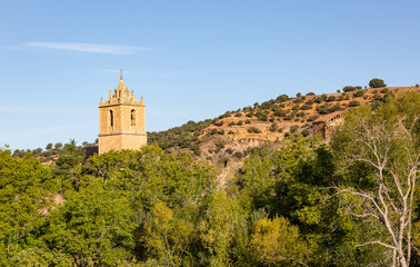Fototapeta na wymiar tower of the San Juan Bautista church in Santibanez de Ayllon, province of Segovia, Castile and Leon, Spain