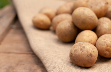 fresh potatoes on the wood box