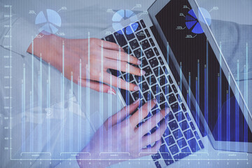 Double exposure of woman hands working on computer and forex chart hologram drawing. Top View. Financial analysis concept.