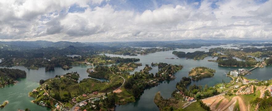 Panorama landscape of  sightseeing  with natural river, lake and mountains and a beautiful blue sky with clouds in el pe&ntilde;ol, Zocalos, en Guatap&eacute;, Medell&iacute;n