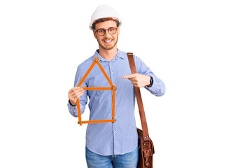 Handsome young man with bear wearing architect hardhat holding build project smiling happy pointing with hand and finger