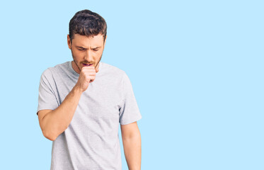 Handsome young man with bear wearing casual tshirt feeling unwell and coughing as symptom for cold or bronchitis. health care concept.