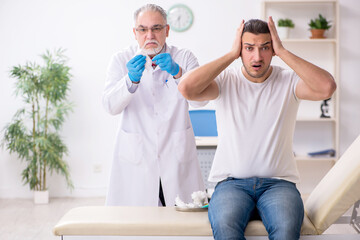 Obraz premium Young man visiting experienced doctor dermatologist