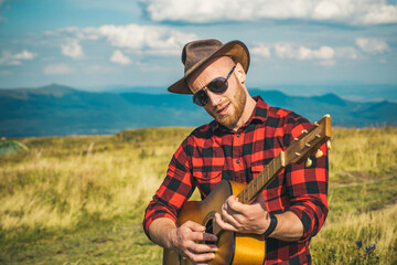 Cowboy western men play on guitar. Lifestyle hiking concept.