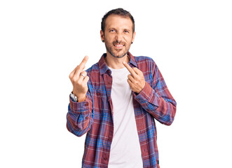 Young handsome man wearing casual clothes showing middle finger doing fuck you bad expression,...