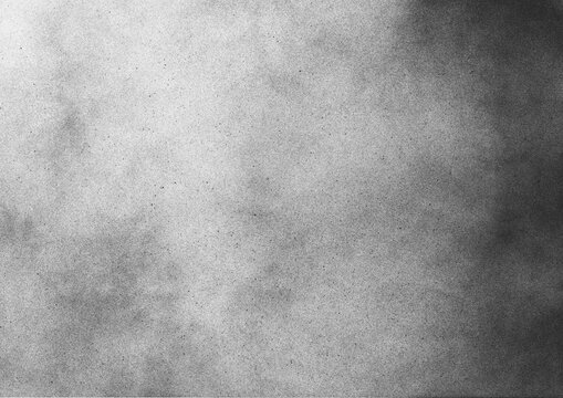 Vintage black and white noise texture. Abstract splattered gradient background for vignette.