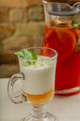 Fresh dessert with white chocolate in a transparent bowl.