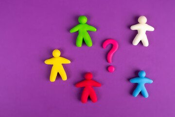 Problems in the team. Individual colored men and a question mark next to them. Disagreements in the team. The problem of human relations. The concept of solving business problems.