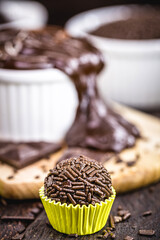 bonbon typical of brazil, known as brigadeiro or negrinho, made of chocolate and sugar in a layer of sprinkles.