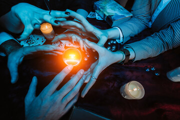 Group of people and woman fortune teller with crystal ball