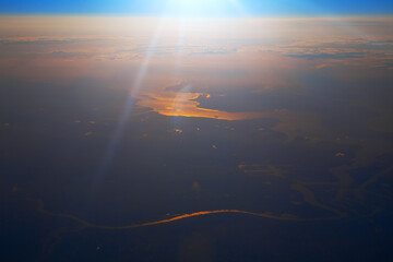 Flying over the wetland in the sunset . Aerial view of golden tide 