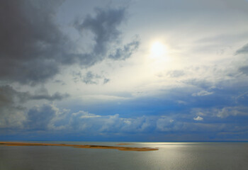 Fototapeta na wymiar Mystical sunrise over the ocean . Island in the sunlight